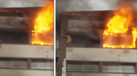 إمرأة تقفز من الطابق الخامس هربا من الحريق!