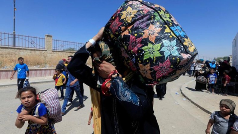 العراق: انتحاري يرتدي زي امرأة يقتل 14 في مخيم للنازحين