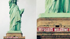 تعليق شعار “مرحباً باللاجئين” على تمثال الحرية في أمريكا