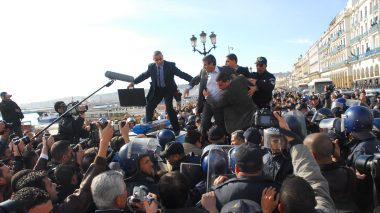 Opposition leader Saadi Saadi stepped over police car: Algerian police break up his party's protest
