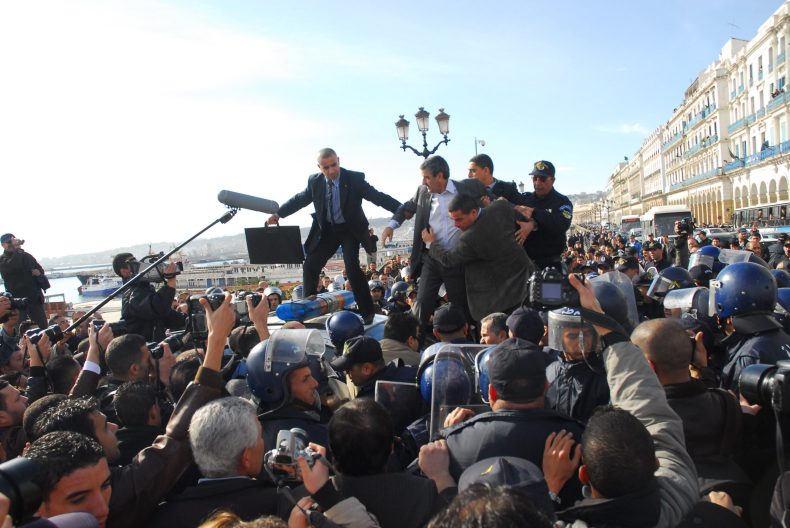 Opposition leader Saadi Saadi stepped over police car: Algerian police break up his party's protest