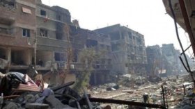 مسلحون فلسطينيون يستعيدون السيطرة على مخيم اليرموك