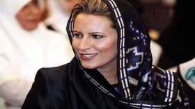 عائشة القذافي تطالب بنسخة من شهادة وفاة والدها