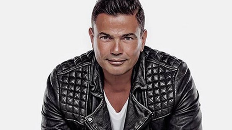 عمرو دياب يُلغي قرار منع المحجبات من حضور حفله