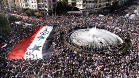Tens of Thousands of Assad Supporters Protest Arab League Vote