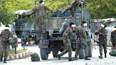 Security forces hand out leaflets to local inhabitants in the mountainous regions.