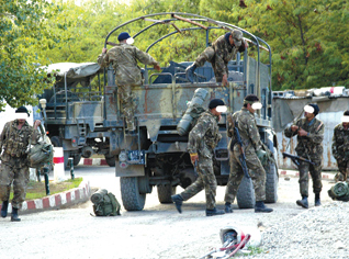 Security forces hand out leaflets to local inhabitants in the mountainous regions.