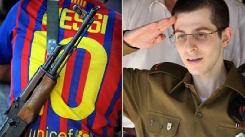 جزائريو إسبانيا استقبلوا شاليط” بأعلام فلسطين والجزائر