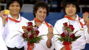 Olympics-Algerian Haddad wins bronze in women's -52kg judo