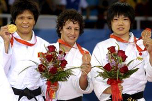 Olympics-Algerian Haddad wins bronze in women's -52kg judo