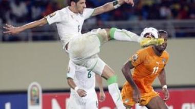 Algerian defender Rafik Halliche talks to Echourok