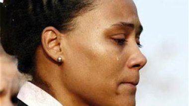 Disgraced sprinter Jones reports to prison