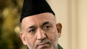 كرزاي: “تلقينا أكياسا من المال من إيران”