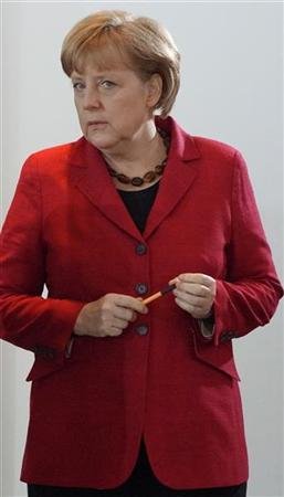 Pas de répit pour Angela Merkel à son retour en Allemagne