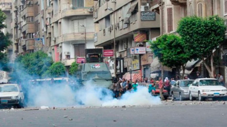 اشتباكات بين مؤيدي مرسي والشرطة في المنيا وأسيوط