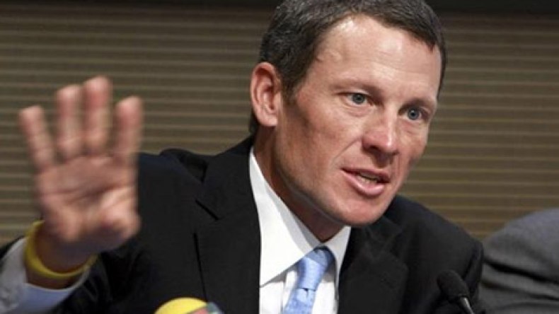 بطل الدراجات السابق أرمسترونغ يتوصل لتسوية مع صحيفة