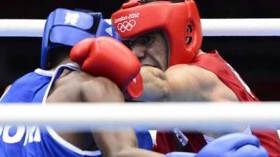 الملاكم وضاحي يقترب من منصة التتويج