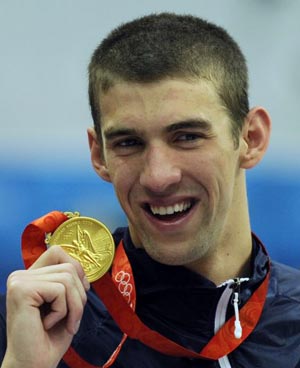 Olympic swimming legend Phelps apologises after being pictured smoking a drug pipe