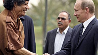 Russia scraps Libya's debts as Putin visits Tripoli