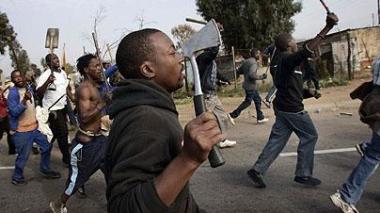 Racists Burn Up an Algerian National in South Africa