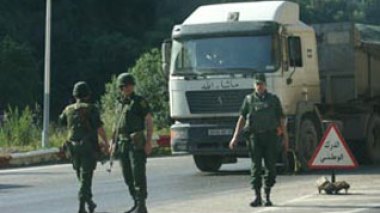 A terrorist surrenders, as security forces dismantle a terrorist back-up cell east of Algiers
