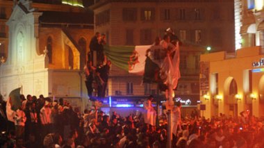 Celebrating Algerians fuel streets of Paris and arouse the curiosity of the French