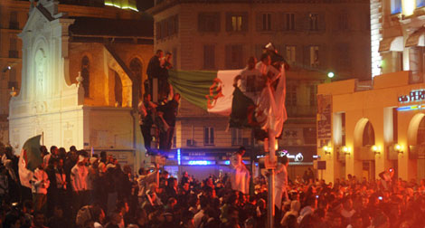 Celebrating Algerians fuel streets of Paris and arouse the curiosity of the French