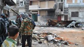 Syrian forces shell rebel city, block aid