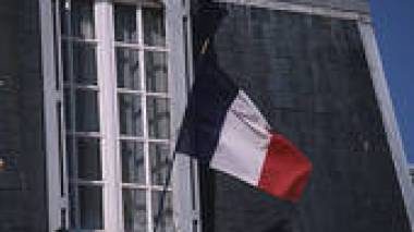 A man placed into custody for hanging the French flat in his balcony