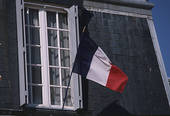 A man placed into custody for hanging the French flat in his balcony