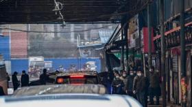 فريق “الصحة العالمية” يزور سوق ووهان بؤرة كورونا