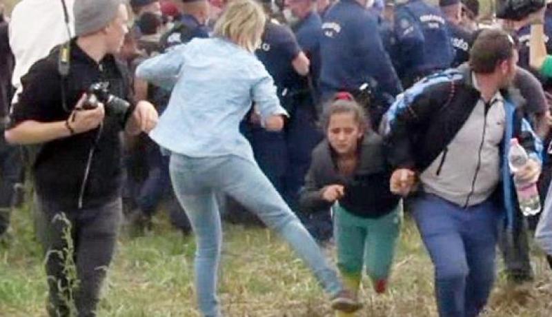المجر توجه اتهامات لمصورة عرقلت لاجئين وهما يركضان
