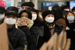 الصين تستغني عن الكمامات الطبية