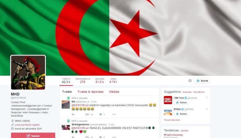 مغني راب فرنسي يشبه  قميص فريق جبهة التحرير الوطني بزي رجال النظافة   ..وهذا هو رد الجزائريين