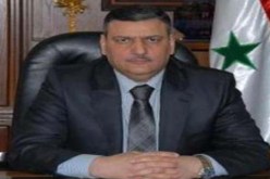 الأسد يقيل رئيس الوزراء بعد انشقاقه