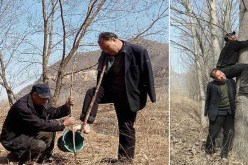 صيني أعمى وآخر بلا ذراعين يزرعان 10 آلاف شجرة