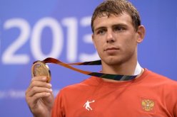 المصارع الروسي ميلينكوف يتوج بذهبية العالم