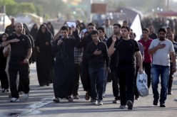 مقتل 21 شخصا وجرح العشرات بانفجارات تستهدف زوارا شيعة في بغداد