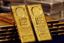 الذهب قلص خسائره والدولار تراجع