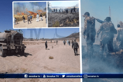 أفراد من الجيش يشاركون مواطنين عملية إخماد حريق في تمنراست