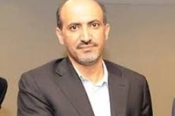 رئيس المعارضة السورية يطالب بزيادة الدعم والاسلحة في باريس