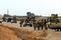 فرار أكثر من 500 معتقل من سجن قرب بغداد في يوم دام قتل فيه نحو 65 شخصا