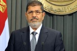 مرسي يهاجم الأعداء ومقتل 2 في اشتباك بين مؤيديه ومعارضيه