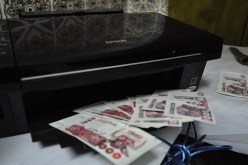 الإطاحة بشبكة ترويج وتزوير الأوراق النقدية من فئة 1000 و2000 دج