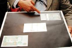 ورقة 2000 دينار معرضة للتزوير