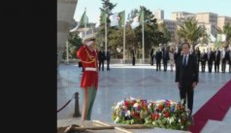 الرئيس هولاند يقف وقفة إجلال أمام النصب التذكاري لشهداء الثورة