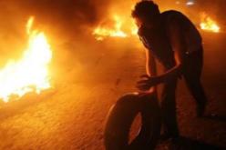 إحراق وتحطيم محلات تجارية يملكها علويون في طرابلس بشمال لبنان