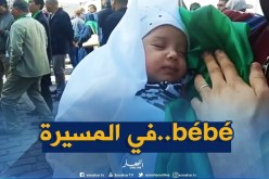 الرضيع “آدم” لا يتجاوز عمره الشهرين يشارك في المسيرة