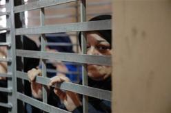 21 طفلا يعيشون داخل سجن للنساء فى بغداد