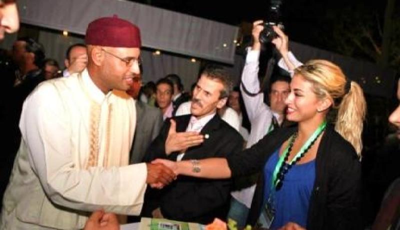 نجل القذافي يستقبل ريم غزالي في أول خرجة لها